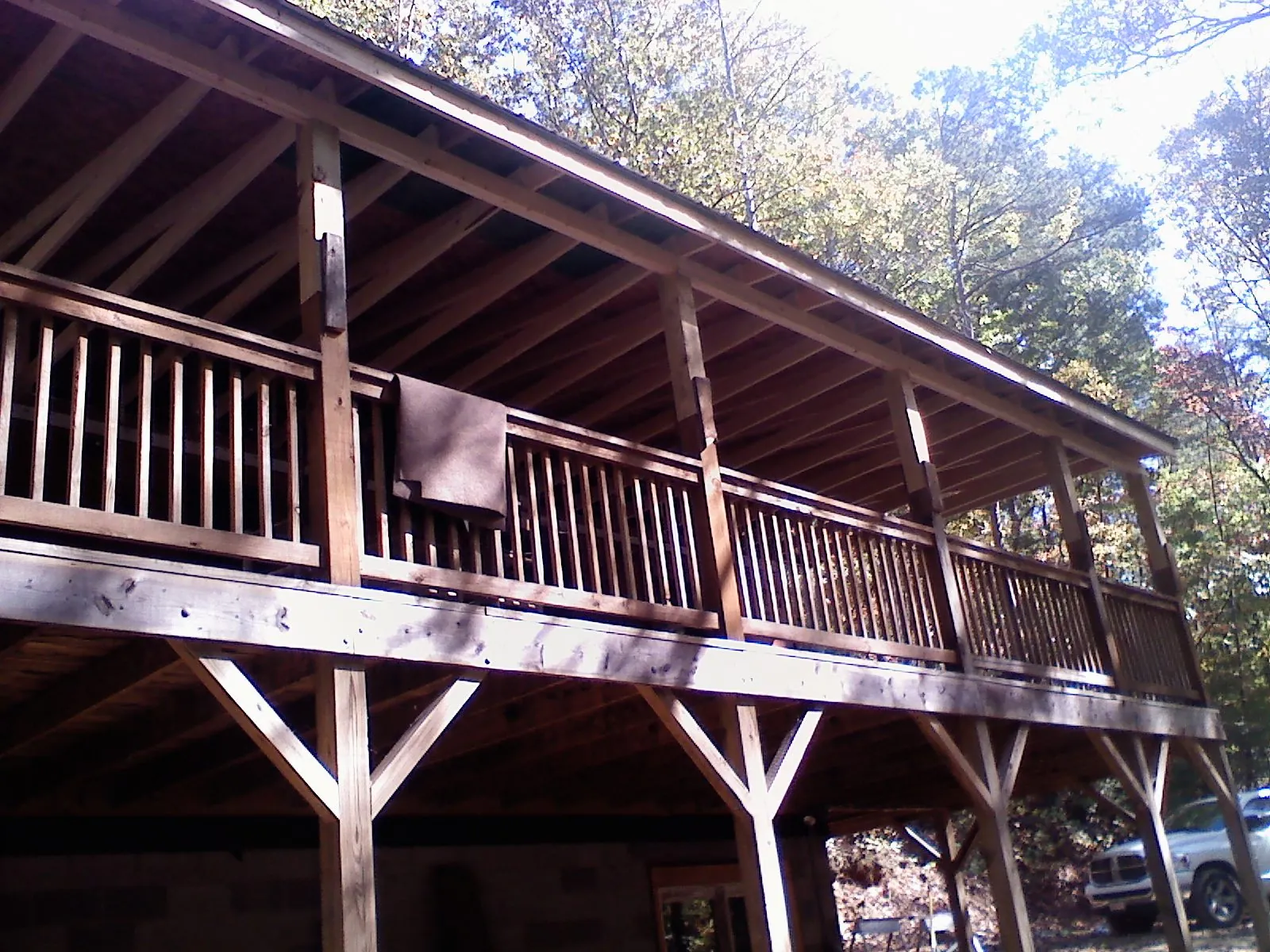 Timber framing under a new elevated porch and deck — Roof Leak Repair in Shutesbury by Roofing Brothers